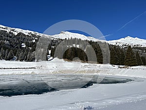 Beautiful winter atmosphere on storage lake Valos or reservoir lake Valos (Speichersee Valos)