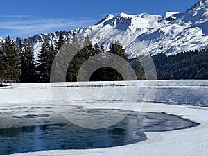 Beautiful winter atmosphere on storage lake Valos or reservoir lake Valos (Speichersee Valos)