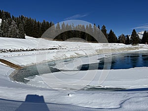 Beautiful winter atmosphere on storage lake Valos or reservoir lake Valos (Speichersee Valos)