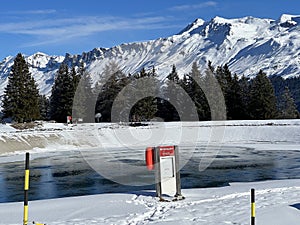 Beautiful winter atmosphere on storage lake Valos or reservoir lake Valos (Speichersee Valos)