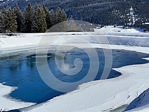 Beautiful winter atmosphere on storage lake Valos or reservoir lake Valos (Speichersee Valos)