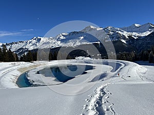 Beautiful winter atmosphere on storage lake Valos or reservoir lake Valos (Speichersee Valos)