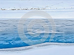 Beautiful winter atmosphere on storage lake Valos or reservoir lake Valos (Speichersee Valos) above the Lenzerheide