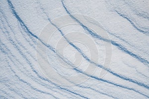 Beautiful winter background with snowy ground. Natural snow texture.