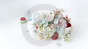 A beautiful winter bouquet in a gentle cold range close-up. Wedding bouquet made of artificial flowers. Greeting card or