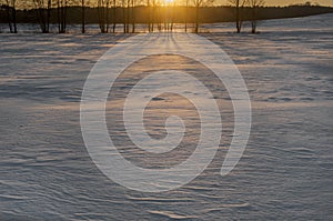 Beautiful winter landscape on the field. Winter sunset