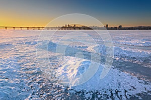 Beautiful winter landscape with frozen river and sunset sky II