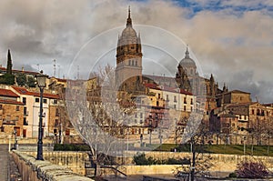 Beautiful winter landscape photo of ancient Salamanca. Catedral Nueva de Salamanca at the top photo