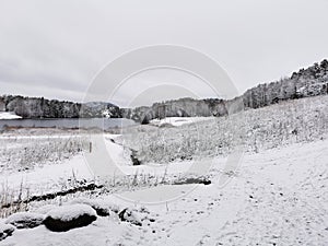 Beautiful winter landscape with the rural road covered with snow in Larvik, Norway