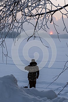 Beautiful winter landscape. Sunset on the river