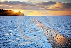 Beautiful winter landscape with sunset sky