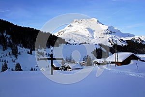 Beautiful Winter Mountain Scenery with Cross