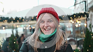 Beautiful winter portrait of young woman in the winter snowy sceneryOutdoor close up portrait of young beautiful happy