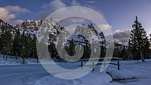 Beautiful winter scene of alpine mountain range and snowy lake