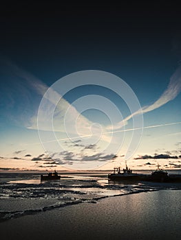 Beautiful winter seascape from cargo ship. Sunrise at cargo port.