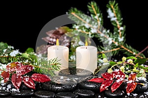 Beautiful winter spa concept of zen basalt stones with drops, li