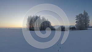 beautiful winter sunrise above farmland fields, time lapse