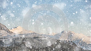 Beautiful Winter sunrise landscape image of Mount Snowdon and other peaks in Snowdonia National Park in heavy snow storm