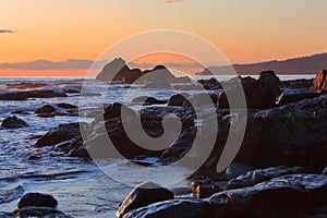 Vancouver Island, Sombrio Beach, Juan de Fuca Marine Provincial Park, Wet Rocks at Sunset on the Pacific Coast, BC, Canada photo