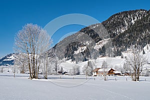 Beautiful winter wonderland mountain scenery with traditional mountain hut in the Alps. Leogang, Tirol, Austria