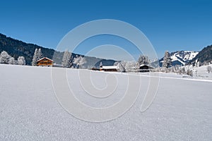 Beautiful winter wonderland mountain scenery with traditional mountain hut in the Alps. Leogang, Tirol, Austria