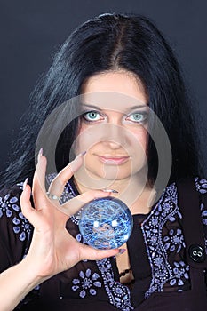 Beautiful witch with magic sphere