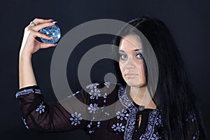 Beautiful witch with magic sphere