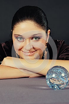 Beautiful witch with magic sphere