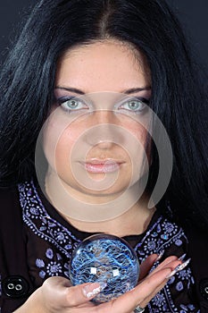 Beautiful witch with magic sphere