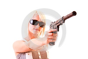 Beautiful woman aiming with gun isolated