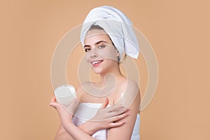 Beautiful woman applying moisturizer cream her face. Beauty concept. Skincare and pampering. Anti aging cream. Young