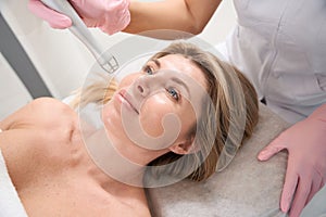 Beautiful woman at the appointment with an esthetician
