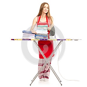 Beautiful woman in apron stack towels clean clothes ironing board iron