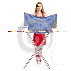 Beautiful woman in apron stack towels clean ironing board iron