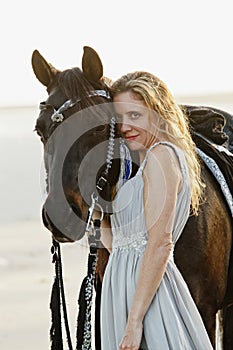 Beautiful woman and arabian horse photo