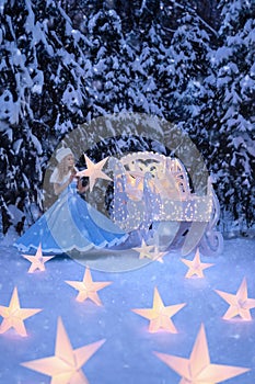 Beautiful woman as snow maiden with sled and stars