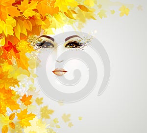 Beautiful woman in autumn circle of leaves