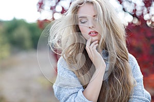 Beautiful woman in autumn park