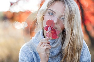 Beautiful woman in autumn park