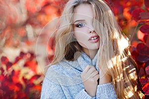 Beautiful woman in autumn park