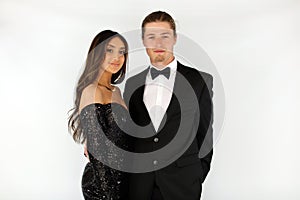 Beautiful woman in back prom dress and handsome guy in suit, teenager ready for a luxury night.