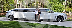 Beautiful woman in back prom dress and handsome guy in suit, teenager ready for a luxury night.