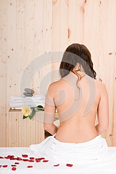 Beautiful woman back in a sauna or massage