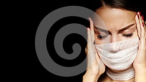 Beautiful woman with bandage mask on face. Fashion eye make-up. Beauty surgery or protection hygiene in covid19 pandemic