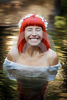 Beautiful woman bathing in a beautiful river