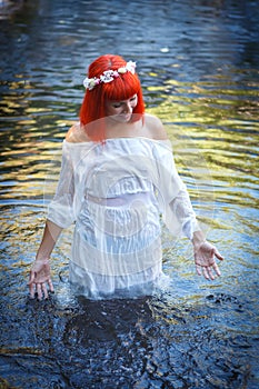 Beautiful woman bathing in a beautiful river