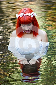 Beautiful woman bathing in a beautiful river