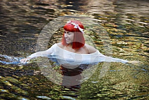 Beautiful woman bathing in a beautiful river