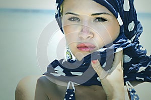 Beautiful woman on the beach.Arabian style.Summer.freckles