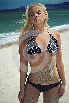 Beautiful woman on the beach. beauty Blond girl in bikini. summer holidays